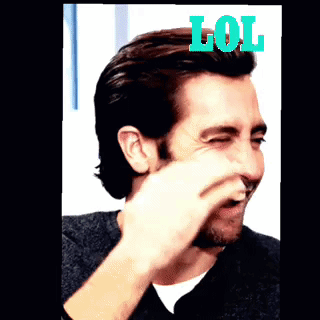 A Man With A Beard Is Laughing With The Word Lol On Top Of Him GIF