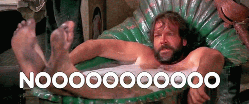 A Man With A Beard Is Laying In A Bathtub With The Words Nooo On The Bottom Right GIF