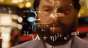 A Man With A Beard Is Looking At Mathematical Equations On A Screen . GIF