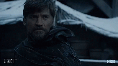 A Man With A Beard Is Looking At The Camera With A Hbo Logo Behind Him GIF