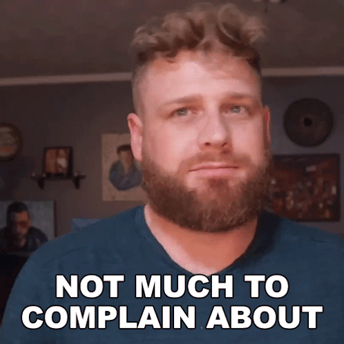 A Man With A Beard Is Making A Face And Says Not Much To Complain About GIF