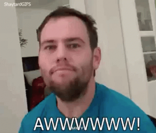 A Man With A Beard Is Making A Funny Face And Saying Awwwwww ! GIF