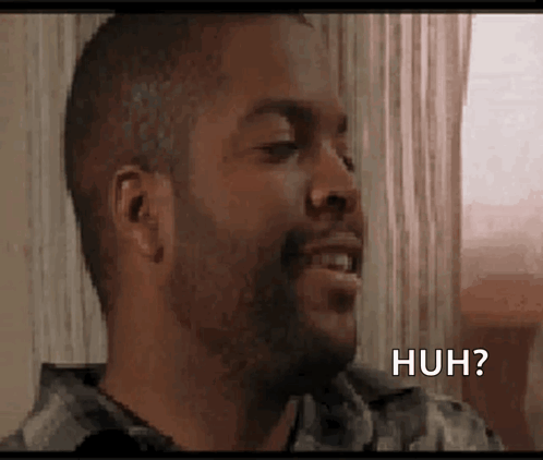 A Man With A Beard Is Making A Funny Face And Saying Huh ? GIF
