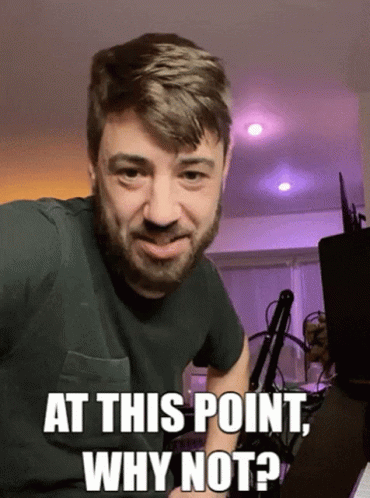A Man With A Beard Is Making A Funny Face And Says At This Point Why Not GIF