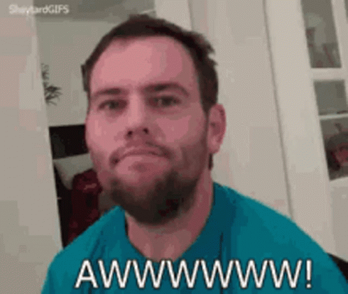 A Man With A Beard Is Making A Funny Face And Says Awwwwww . GIF