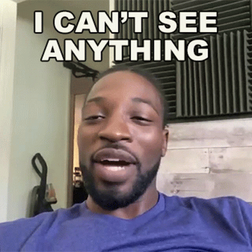 A Man With A Beard Is Making A Funny Face And Says I Can T See Anything GIF