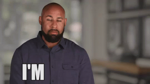A Man With A Beard Is Making A Funny Face And Says I 'M GIF