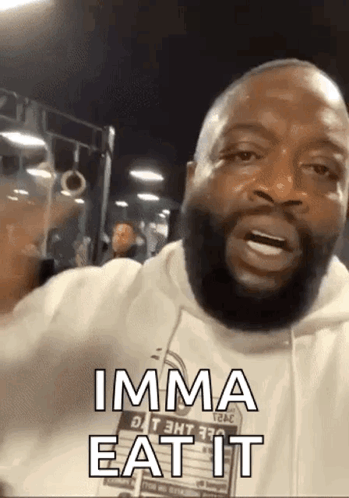 A Man With A Beard Is Making A Funny Face And Says Imma Eat It . GIF