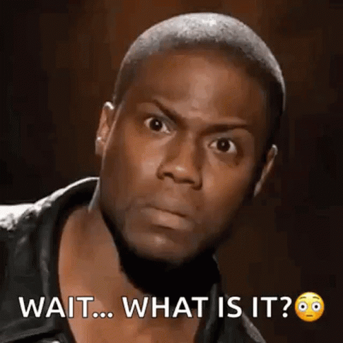 A Man With A Beard Is Making A Funny Face And Says `` Wait ... What Is It ? '' GIF