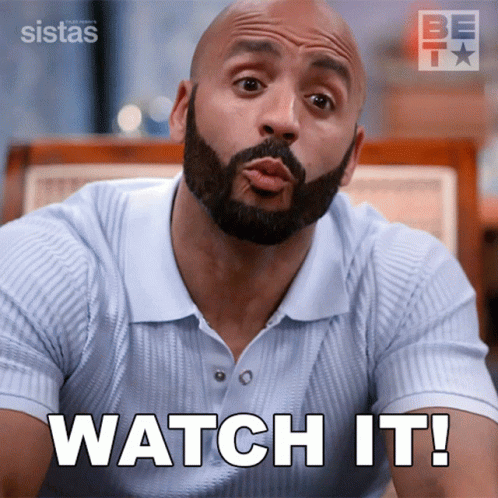 A Man With A Beard Is Making A Funny Face And Says Watch It GIF