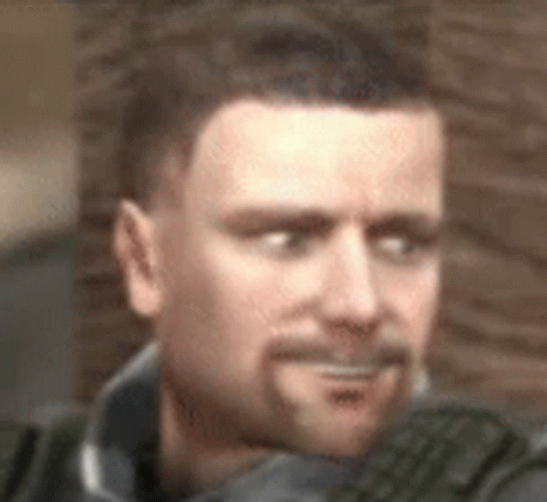 A Man With A Beard Is Making A Funny Face In A Blurry Photo . GIF