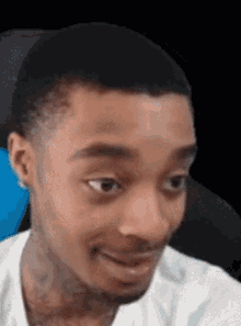 A Man With A Beard Is Making A Funny Face While Looking At The Camera . GIF