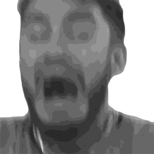 a man with a beard is making a funny face with his mouth open
