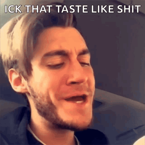 a man with a beard is making a funny face with the words " ick that taste like shit " above him
