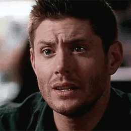 A Man With A Beard Is Making A Surprised Face . GIF