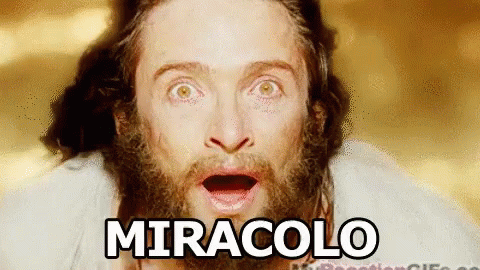 A Man With A Beard Is Making A Surprised Face And The Word Miracolo Is Written Above Him . GIF
