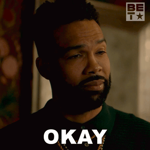 A Man With A Beard Is Making An Okay Sign With His Eyes Closed GIF