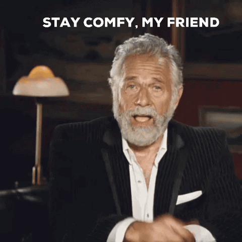 a man with a beard is pointing at the camera with the words stay comfy my friend behind him
