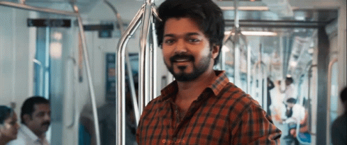 A Man With A Beard Is Riding A Subway Train . GIF