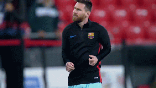 A Man With A Beard Is Running On A Field GIF