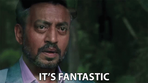A Man With A Beard Is Saying `` It 'S Fantastic '' While Looking At The Camera . GIF