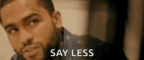 A Man With A Beard Is Saying `` Say Less '' While Looking At The Camera . GIF