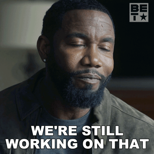 A Man With A Beard Is Saying " We 'Re Still Working On That " GIF