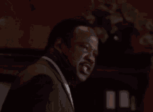 A Man With A Beard Is Screaming And The Words Shhhhiiiiiiiii Are On A Black Background GIF