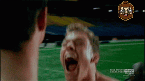 A Man With A Beard Is Screaming In Front Of Another Man GIF