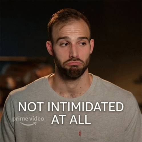 A Man With A Beard Is Shown With The Words Not Intimidated At All On The Bottom GIF
