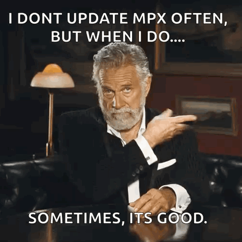A Man With A Beard Is Sitting At A Table With A Caption That Says I Dont Update Mpx Often But GIF