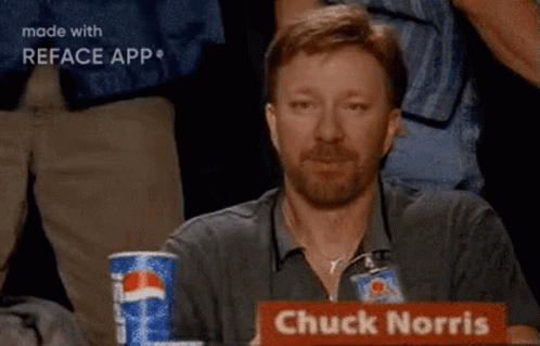 A Man With A Beard Is Sitting At A Table With A Pepsi Can In Front Of Him . GIF