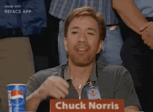 A Man With A Beard Is Sitting At A Table With A Pepsi Can In Front Of Him . GIF