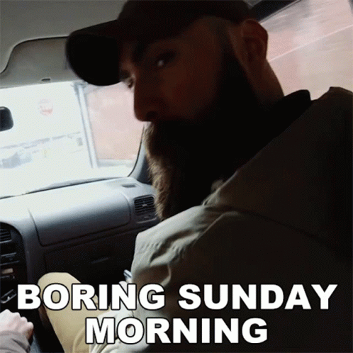 A Man With A Beard Is Sitting In A Car With The Words Boring Sunday Morning Above Him GIF
