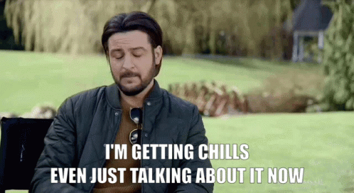 A Man With A Beard Is Sitting In A Chair And Saying I 'M Getting Chills GIF
