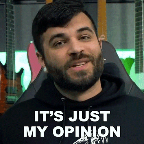 A Man With A Beard Is Sitting In A Chair And Says It 'S Just My Opinion GIF