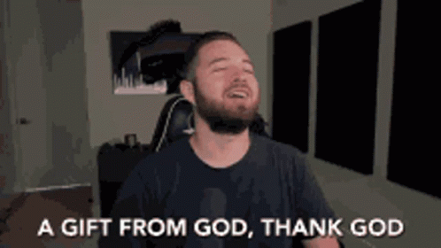 A Man With A Beard Is Sitting In A Chair With His Eyes Closed And Says A Gift From God Thank God GIF