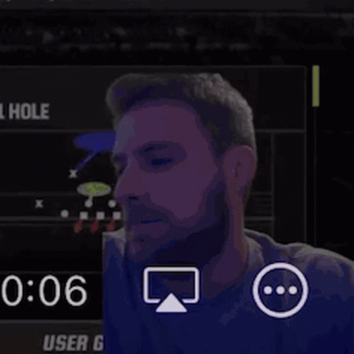 A Man With A Beard Is Sitting In Front Of A Screen That Says 1:06 GIF