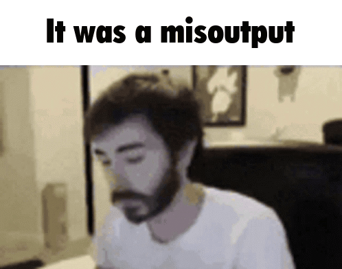 A Man With A Beard Is Sitting In Front Of A Screen That Says It Was A Misooutput GIF