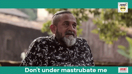 A Man With A Beard Is Sitting In Front Of A Sign That Says Don 'T Under Mastrubate Me GIF