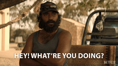 A Man With A Beard Is Sitting In Front Of A Truck And Says " Hey What 'Re You Doing " GIF