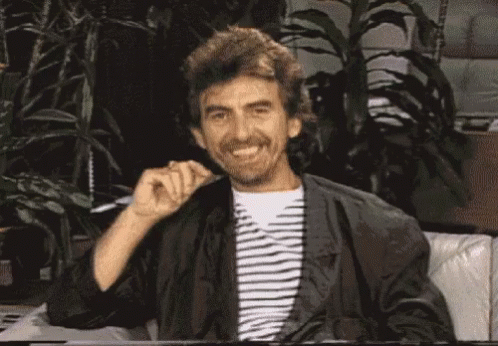 A Man With A Beard Is Sitting On A Couch And Says It 'S George Harrison ... Remember Me ? GIF