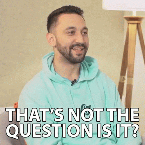 A Man With A Beard Is Sitting On A Couch And Says That 'S Not The Question Is It . GIF