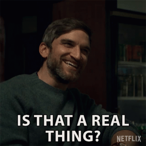 A Man With A Beard Is Smiling And Asking Is That A Real Thing GIF