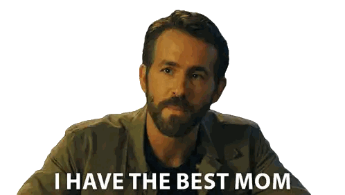 a man with a beard is smiling and looking to the side