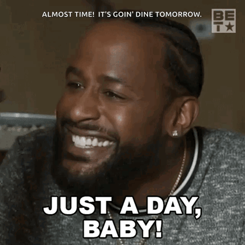 A Man With A Beard Is Smiling And Says Just A Day Baby GIF