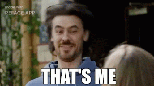 A Man With A Beard Is Smiling And Says `` That 'S Me '' . GIF