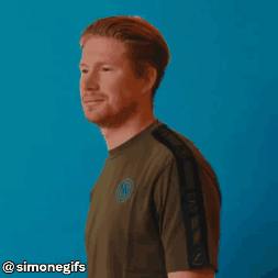 A Man With A Beard Is Smiling In Front Of A Blue Background With Simonegifs Written On The Bottom GIF