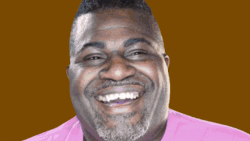 A Man With A Beard Is Smiling In Front Of A Colorful Sign That Says Bubbly GIF