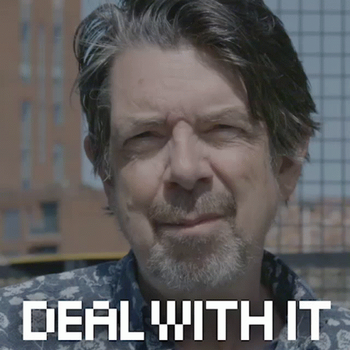 A Man With A Beard Is Smiling With The Words Deal With It Behind Him GIF